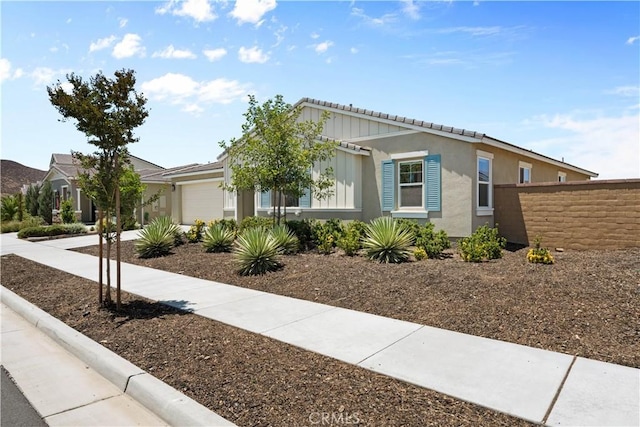30071 Merrick Ln, Menifee, CA 92584 - single story home with a garage, stucco siding, and driveway