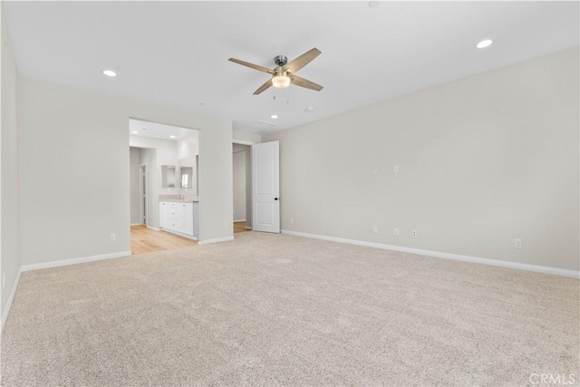 30071 Merrick Ln, Menifee, CA 92584 - empty room with light carpet, a ceiling fan, and recessed lighting