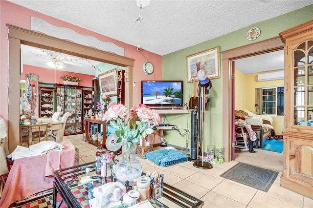 11847 Alabama St, Los Angeles, CA 90059 - tiled living room featuring a wall mounted AC and a textured ceiling