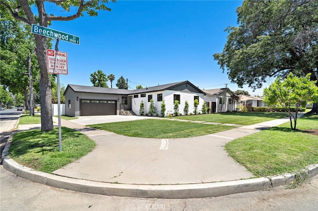 2405 Larchmont Ave, Santa Ana, CA 92706 - view of front of property with an attached garage, a front lawn, and concrete driveway