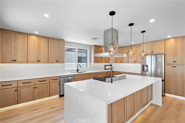2405 Larchmont Ave, Santa Ana, CA 92706 - kitchen with appliances with stainless steel finishes, light wood-type flooring, an island with sink, island range hood, and recessed lighting