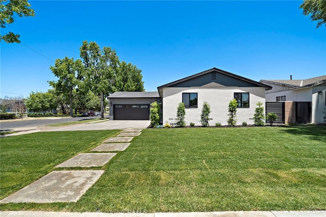 2405 Larchmont Ave, Santa Ana, CA 92706 - view of front of home with driveway, an attached garage, and stucco siding
