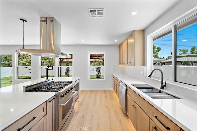 2405 Larchmont Ave, Santa Ana, CA 92706 - kitchen with appliances with stainless steel finishes, island range hood, light wood-style flooring, recessed lighting, and hanging light fixtures
