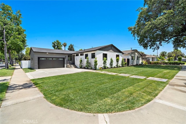 2405 Larchmont Ave, Santa Ana, CA 92706 - single story home featuring a garage, concrete driveway, and a front lawn