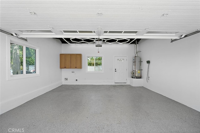 2405 Larchmont Ave, Santa Ana, CA 92706 - garage featuring a garage door opener and water heater