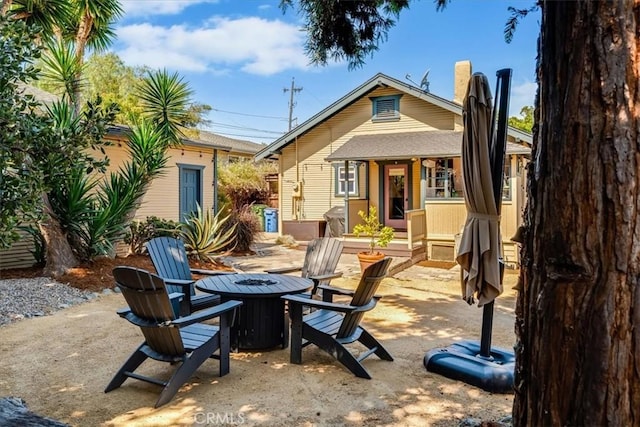 680 Howard St, San Luis Obispo, CA 93401 - rear view of property with a fire pit