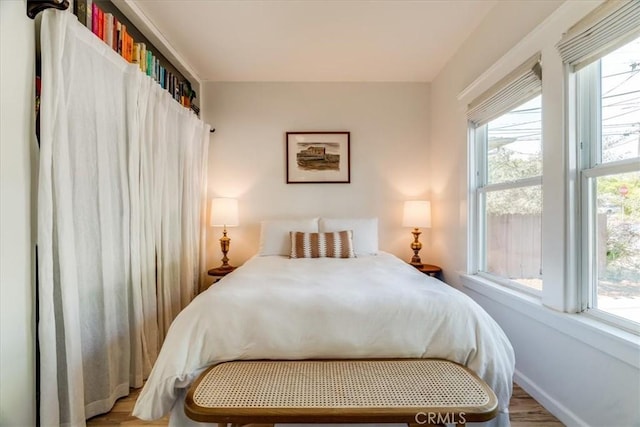 680 Howard St, San Luis Obispo, CA 93401 - bedroom featuring wood finished floors and multiple windows