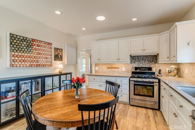 680 Howard St, San Luis Obispo, CA 93401 - kitchen featuring gas stove, white cabinets, light countertops, and recessed lighting