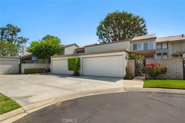 5540 E Vista Del Este, Anaheim, CA 92807 - view of front facade with stucco siding, concrete driveway, a garage, and a tiled roof