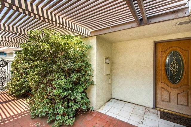 5540 E Vista Del Este, Anaheim, CA 92807 - property entrance with stucco siding and a pergola