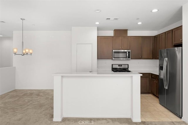 1708 Presidio Pl Unit 1, Chula Vista, CA 91913 - kitchen featuring appliances with stainless steel finishes, a chandelier, light countertops, a kitchen island, and recessed lighting