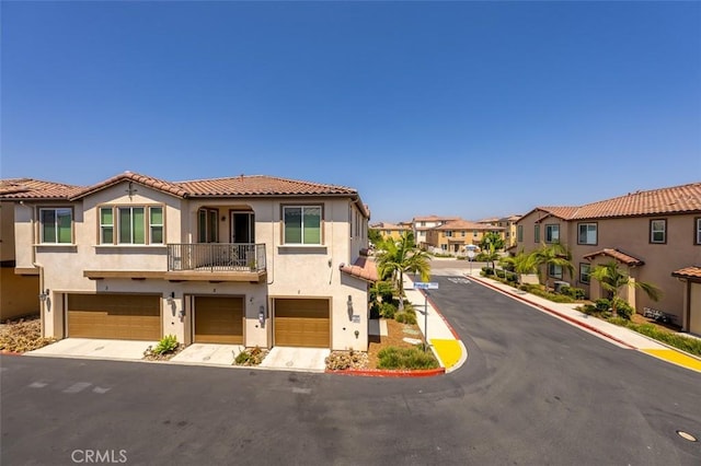 1708 Presidio Pl Unit 1, Chula Vista, CA 91913 - view of front of home with a residential view, a garage, a balcony, a tile roof, and stucco siding