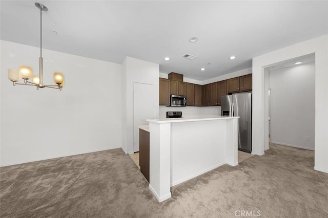 1708 Presidio Pl Unit 1, Chula Vista, CA 91913 - kitchen with appliances with stainless steel finishes, light colored carpet, light countertops, dark brown cabinets, and recessed lighting