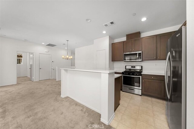 1708 Presidio Pl Unit 1, Chula Vista, CA 91913 - kitchen with stainless steel appliances, light countertops, a chandelier, a kitchen island, and recessed lighting