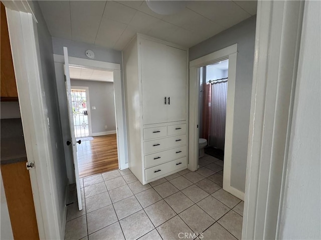 714 E Chapman Ave, Fullerton, CA 92831 - hallway with light tile patterned flooring and baseboards
