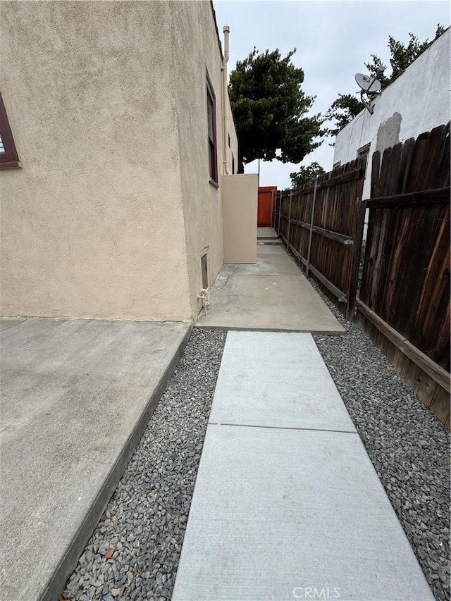 714 E Chapman Ave, Fullerton, CA 92831 - view of side of property featuring stucco siding and a patio area