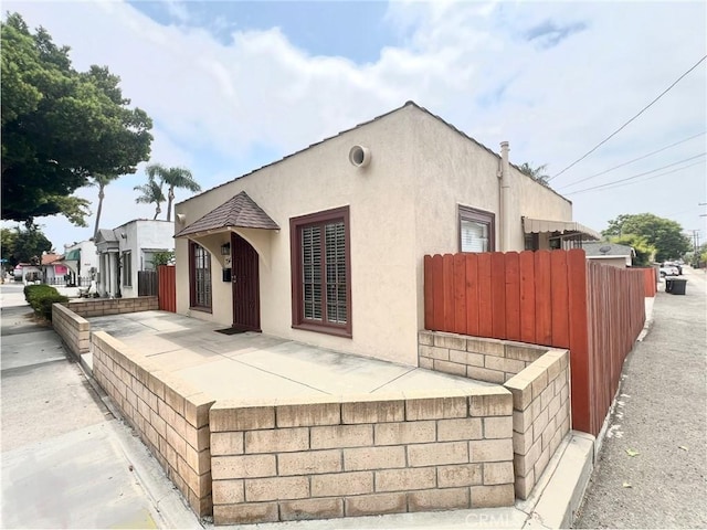 714 E Chapman Ave, Fullerton, CA 92831 - view of front of property with stucco siding and a patio area