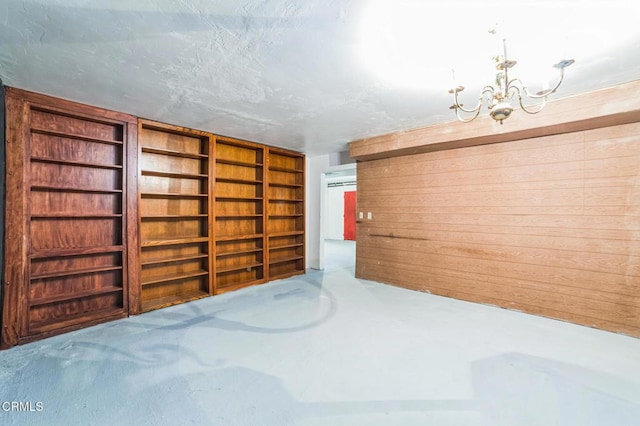 352 Cedarbrook Dr, Twin Peaks, CA 92391 - spare room with a chandelier and concrete flooring