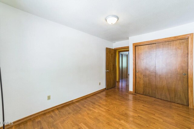 352 Cedarbrook Dr, Twin Peaks, CA 92391 - unfurnished bedroom featuring light wood-style floors and a closet