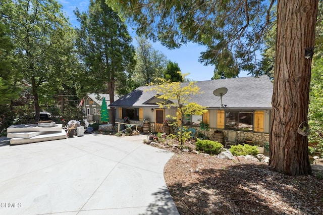 352 Cedarbrook Dr, Twin Peaks, CA 92391 - view of front facade with stone siding and roof with shingles