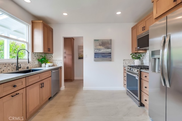 2609 S Leland St, San Pedro, CA 90731 - kitchen featuring appliances with stainless steel finishes, backsplash, recessed lighting, and light brown cabinets