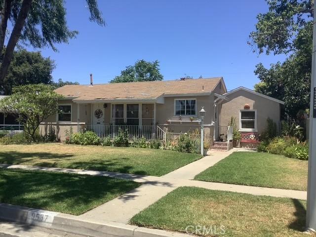 9537 Mines Ave, Pico Rivera, CA 90660 - ranch-style home with a front lawn and stucco siding