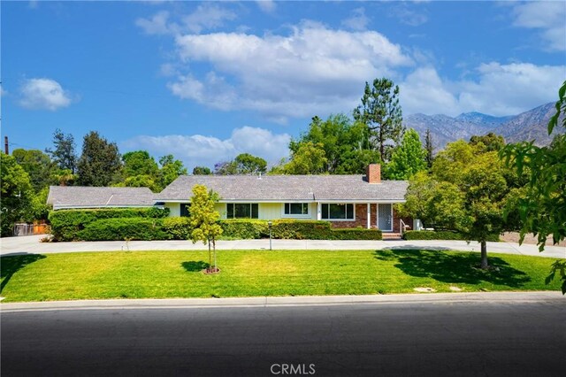 1521 Marendale Ln, Arcadia, CA 91006 - single story home with a chimney, a front lawn, a mountain view, and driveway