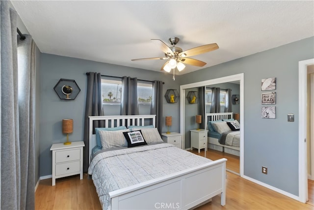 74183 Aster Dr, Palm Desert, CA 92260 - bedroom with light wood-style flooring, a closet, and ceiling fan