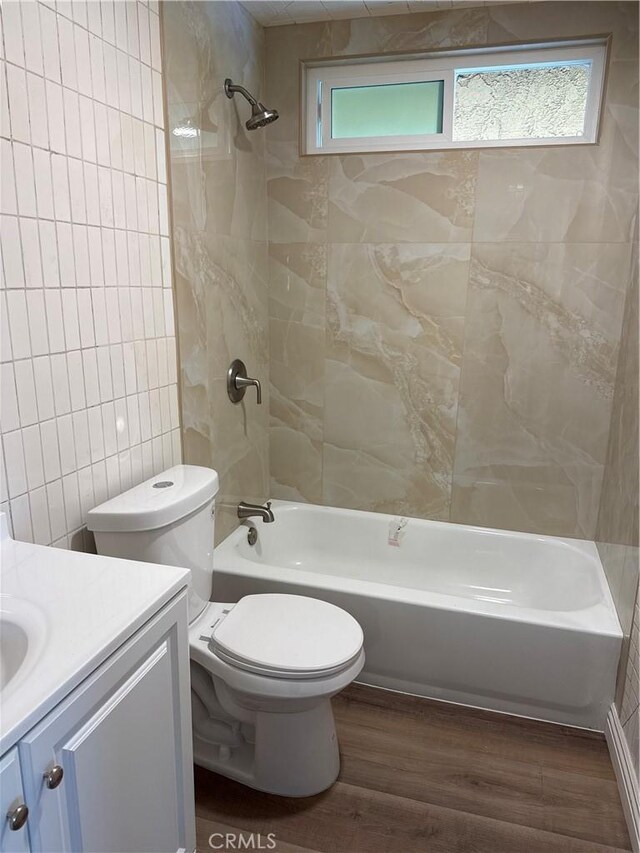 1323 S Standard Ave Unit A, Santa Ana, CA 92707 - full bathroom with tile walls, vanity, wood finished floors, and bathing tub / shower combination