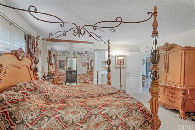 32303 Bilton Way, Wildomar, CA 92595 - bedroom with light carpet, a wood stove, and a textured ceiling