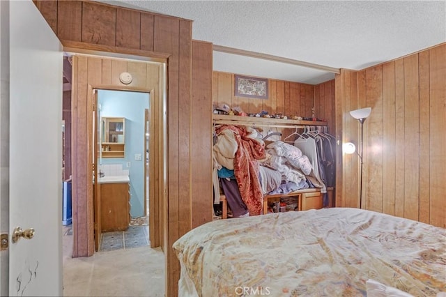 32303 Bilton Way, Wildomar, CA 92595 - bedroom featuring wood walls, a textured ceiling, carpet flooring, and ensuite bathroom