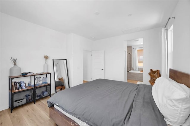 389 Allen Dr, Santa Paula, CA 93060 - bedroom with light wood-style floors and connected bathroom