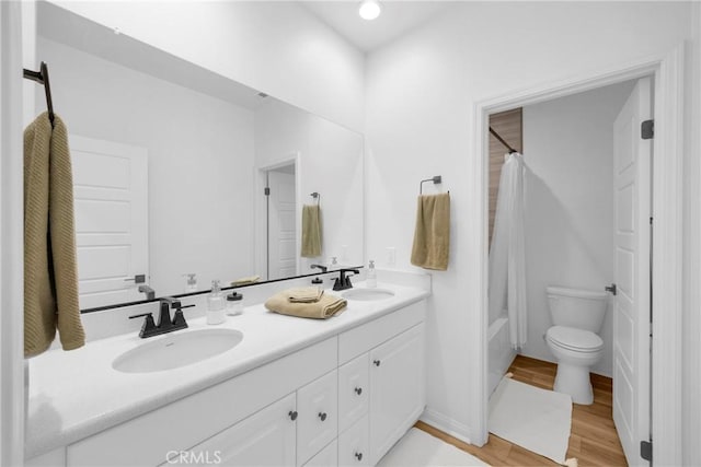 389 Allen Dr, Santa Paula, CA 93060 - bathroom featuring double vanity, shower / tub combo, and wood finished floors