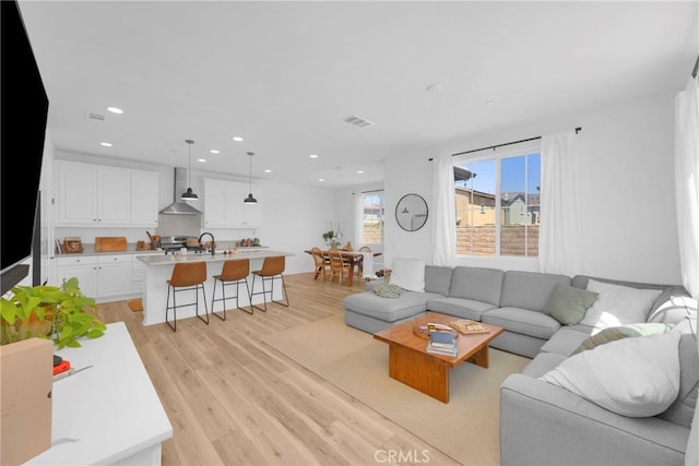 389 Allen Dr, Santa Paula, CA 93060 - living area featuring light wood-style floors and recessed lighting