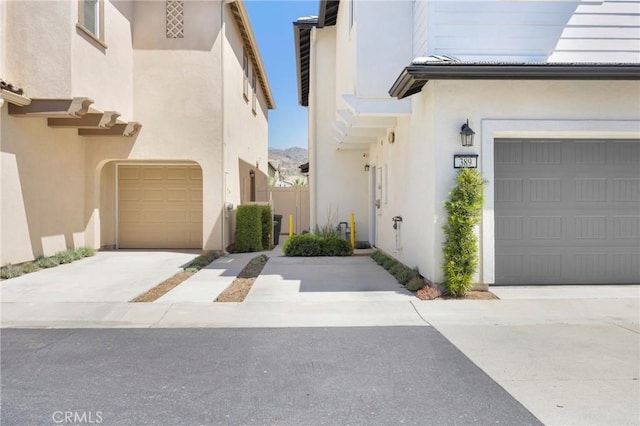 389 Allen Dr, Santa Paula, CA 93060 - property entrance with stucco siding, driveway, and an attached garage