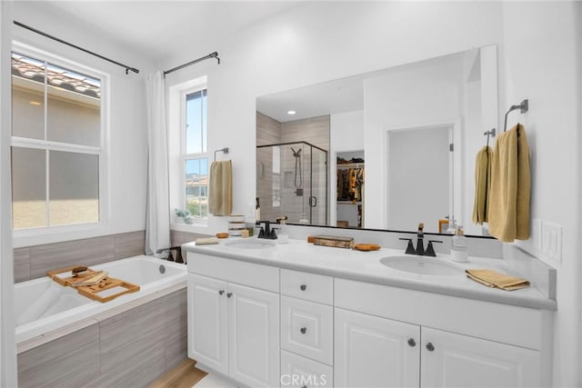 389 Allen Dr, Santa Paula, CA 93060 - bathroom with a stall shower, double vanity, a walk in closet, and a bath