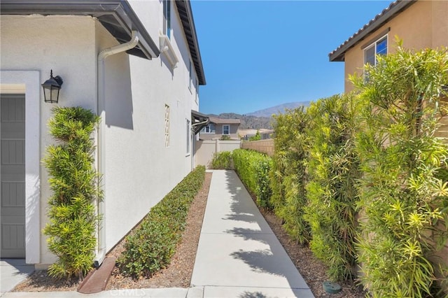 389 Allen Dr, Santa Paula, CA 93060 - view of home's exterior with stucco siding and a mountain view