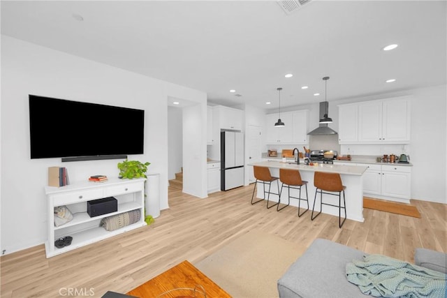389 Allen Dr, Santa Paula, CA 93060 - living room with light wood-style floors and recessed lighting