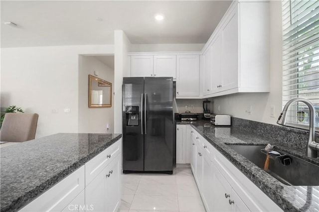 7911 Cold Creek St, Riverside, CA 92507 - kitchen featuring stainless steel fridge, light marble finish flooring, white cabinets, dark stone counters, and recessed lighting