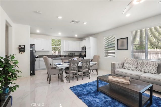7911 Cold Creek St, Riverside, CA 92507 - living area with recessed lighting and light marble finish floors