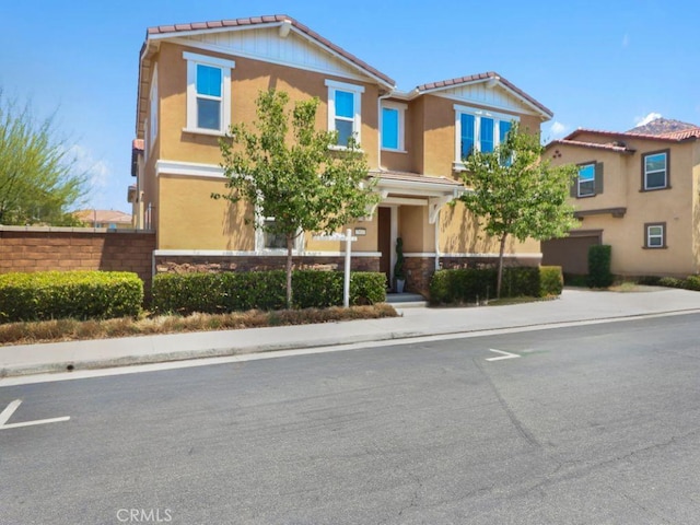 7911 Cold Creek St, Riverside, CA 92507 - view of front of property with stone siding and stucco siding