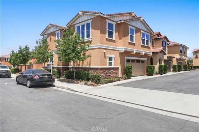 7911 Cold Creek St, Riverside, CA 92507 - view of front of home with an attached garage, a tiled roof, stucco siding, and a residential view
