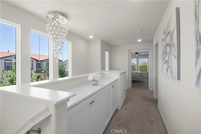 7911 Cold Creek St, Riverside, CA 92507 - hallway with light carpet, recessed lighting, and a chandelier
