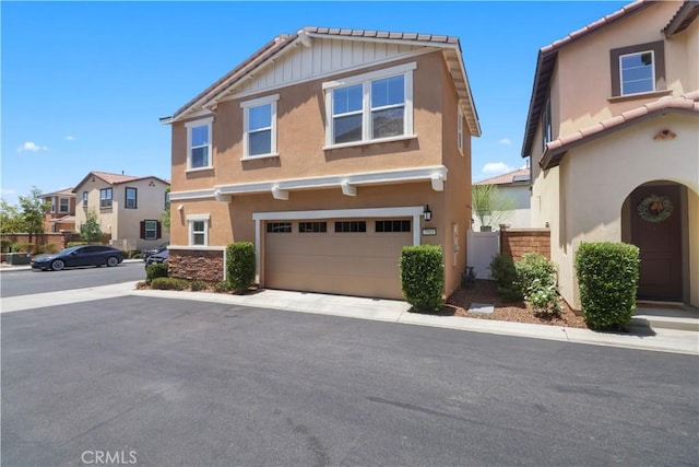 7911 Cold Creek St, Riverside, CA 92507 - view of property featuring a garage, stucco siding, and asphalt driveway