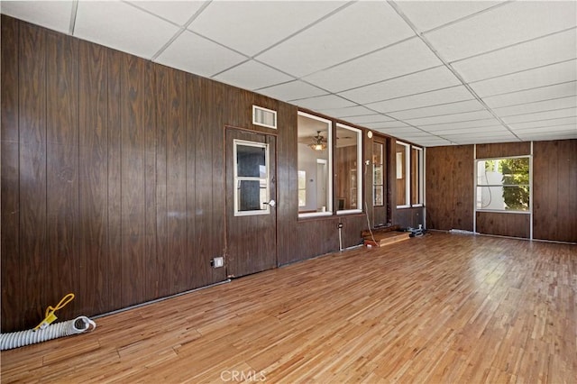 7737 Nestle Ave, Reseda, CA 91335 - empty room with a paneled ceiling, wood finished floors, and wood walls