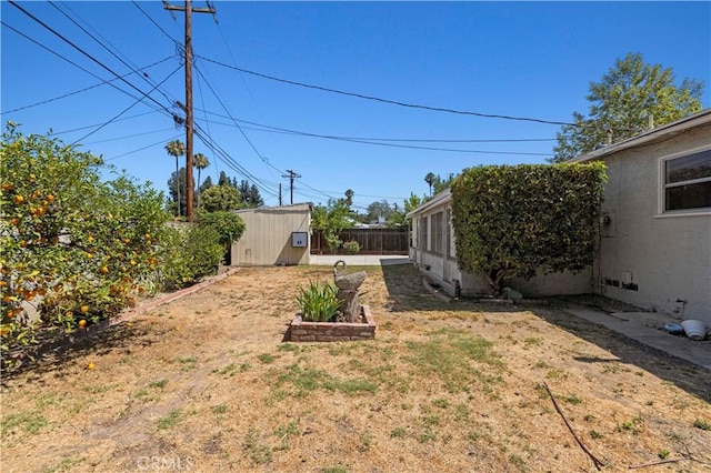 7737 Nestle Ave, Reseda, CA 91335 - fenced backyard with a shed