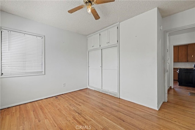 7737 Nestle Ave, Reseda, CA 91335 - unfurnished bedroom with light wood-style floors, a closet, a textured ceiling, and a ceiling fan