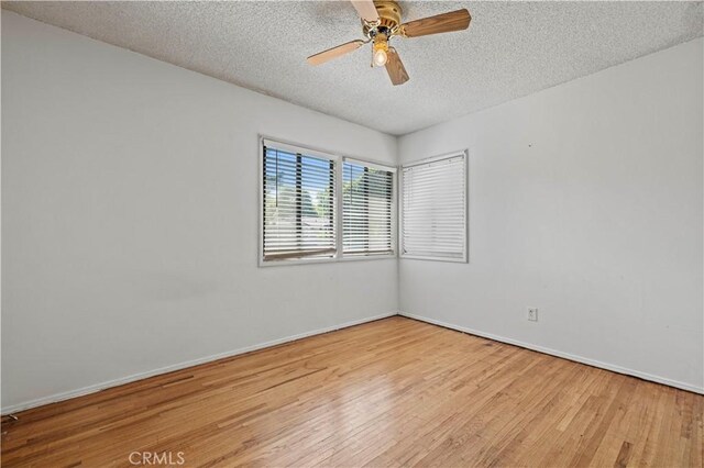 7737 Nestle Ave, Reseda, CA 91335 - spare room with wood finished floors, a textured ceiling, and a ceiling fan