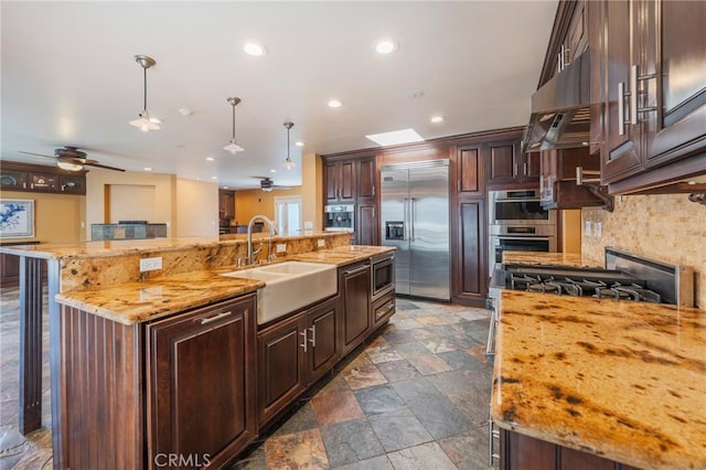 805 Ocean Ave Unit 6, Seal Beach, CA 90740 - kitchen featuring built in appliances, ceiling fan, decorative light fixtures, recessed lighting, and dark brown cabinets