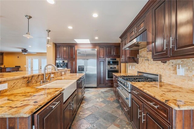 805 Ocean Ave Unit 6, Seal Beach, CA 90740 - kitchen featuring high end appliances, under cabinet range hood, french doors, tasteful backsplash, and recessed lighting